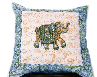 May include: A white cotton pillow cover with a green and orange elephant design. The pillow cover has a paisley pattern border in blue and green.