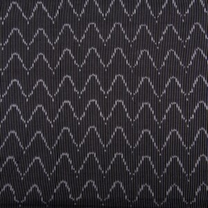 May include: Black fabric with a white wave pattern.