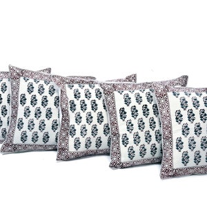 May include: Set of five white cotton pillow covers with a dark blue and maroon paisley print. The pillow covers have a decorative border.