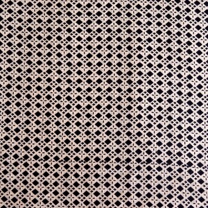 May include: A white fabric with a black diamond pattern.