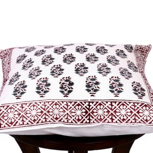 May include: White cotton pillow cover with a burgundy and gray floral print. The pillow cover has a burgundy border with a geometric pattern.