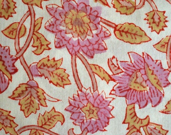 May include: A white fabric with a pink and orange floral pattern. The flowers are stylized and have a vintage look.