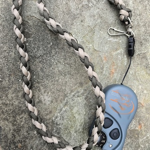 Paracord lanyard approximately 32" long for your ecollar remote.  Includes 2 heavy duty connectors. Multiple color combinations available.