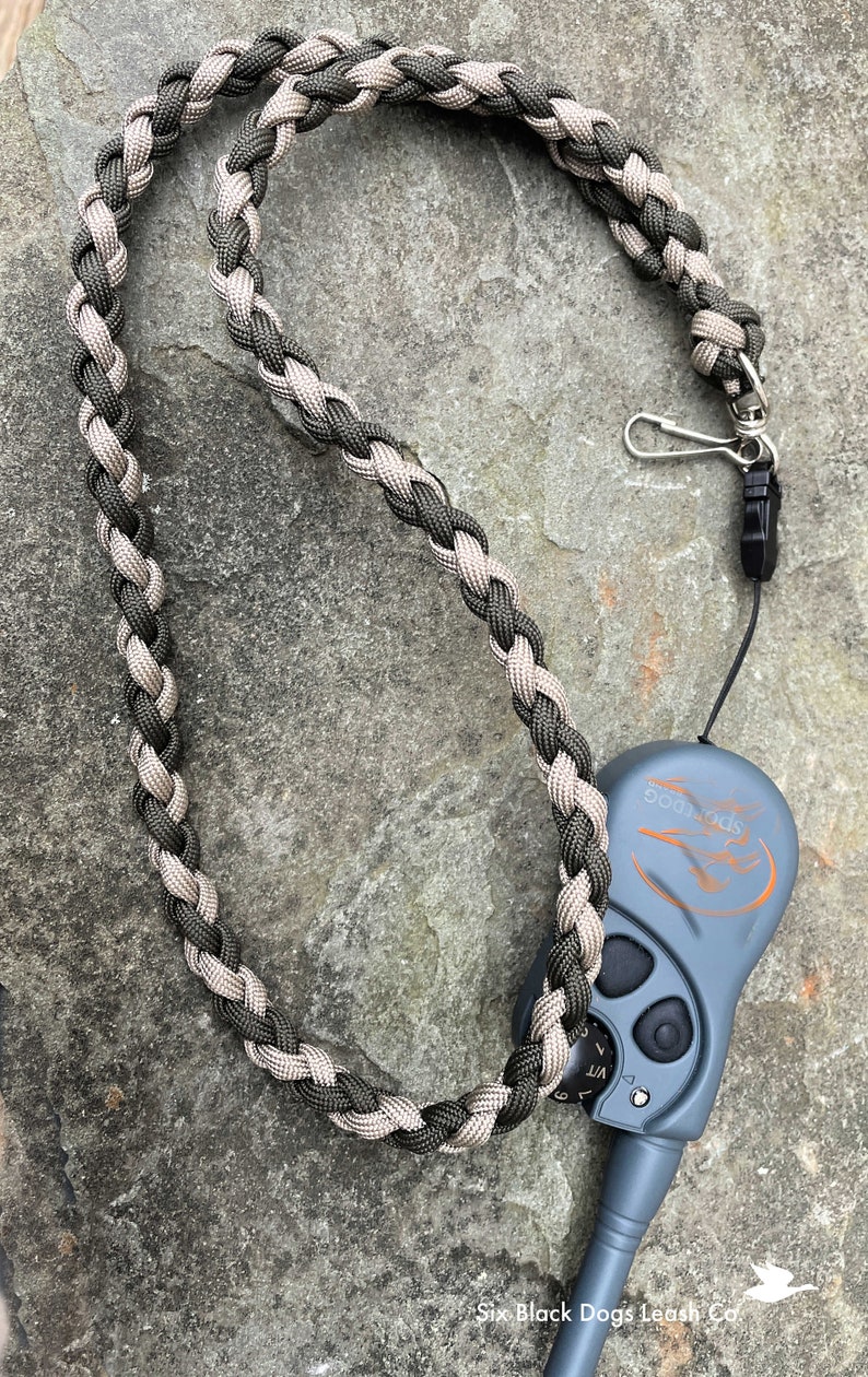 Paracord lanyard approximately 32" long for your ecollar remote.  Includes 2 heavy duty connectors. Multiple color combinations available.