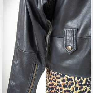 Vintage 80s-90s, new wave style iconic black leather Motorcycle Jacket, designed by ANDREW MARC. The leather is "butter" soft and medium weight. This jacket has a wonderful "new wave" vibe, the shoulders are oversized and padded.