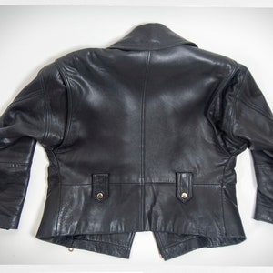 Vintage 80s-90s, new wave style iconic black leather Motorcycle Jacket, designed by ANDREW MARC. The leather is "butter" soft and medium weight. This jacket has a wonderful "new wave" vibe, the shoulders are oversized and padded.
