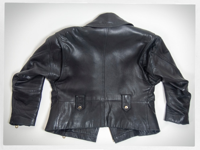 Vintage 80s-90s, new wave style iconic black leather Motorcycle Jacket, designed by ANDREW MARC. The leather is "butter" soft and medium weight. This jacket has a wonderful "new wave" vibe, the shoulders are oversized and padded.
