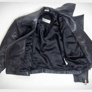 Vintage 80s-90s, new wave style iconic black leather Motorcycle Jacket, designed by ANDREW MARC. The leather is "butter" soft and medium weight. This jacket has a wonderful "new wave" vibe, the shoulders are oversized and padded.