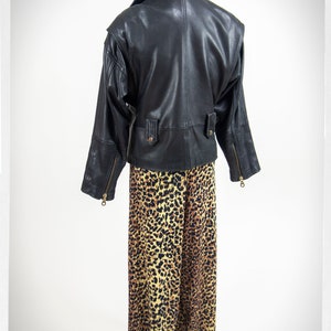 Vintage 80s-90s, new wave style iconic black leather Motorcycle Jacket, designed by ANDREW MARC. The leather is "butter" soft and medium weight. This jacket has a wonderful "new wave" vibe, the shoulders are oversized and padded.