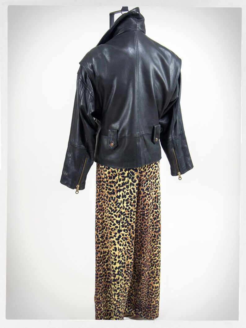 Vintage 80s-90s, new wave style iconic black leather Motorcycle Jacket, designed by ANDREW MARC. The leather is "butter" soft and medium weight. This jacket has a wonderful "new wave" vibe, the shoulders are oversized and padded.