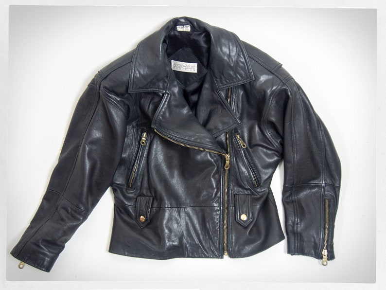 Vintage 80s-90s, new wave style iconic black leather Motorcycle Jacket, designed by ANDREW MARC. The leather is "butter" soft and medium weight. This jacket has a wonderful "new wave" vibe, the shoulders are oversized and padded.