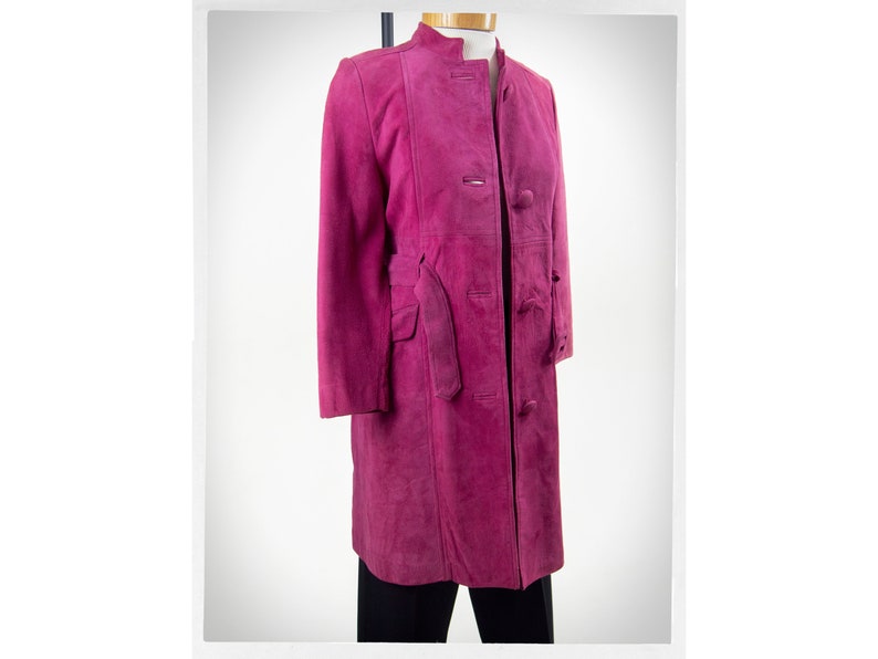 From Oshawa66Vintage.com online consignment store and luxury resale vintage clothing for men and ladies. Vintage 60s-70s mod style dark hot pink kid suede coat with a low profile mandarin collar.