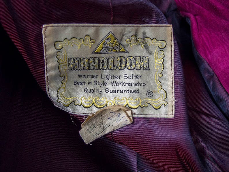 From Oshawa66Vintage.com online consignment store and luxury resale vintage clothing for men and ladies. Vintage 60s-70s mod style dark hot pink kid suede coat with a low profile mandarin collar.