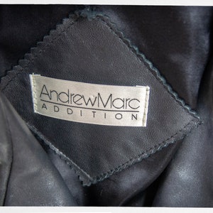 Vintage 80s-90s, new wave style iconic black leather Motorcycle Jacket, designed by ANDREW MARC. The leather is "butter" soft and medium weight. This jacket has a wonderful "new wave" vibe, the shoulders are oversized and padded.