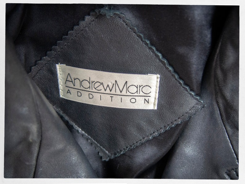 Vintage 80s-90s, new wave style iconic black leather Motorcycle Jacket, designed by ANDREW MARC. The leather is "butter" soft and medium weight. This jacket has a wonderful "new wave" vibe, the shoulders are oversized and padded.