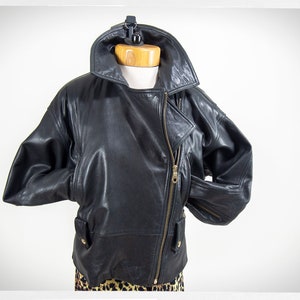 Vintage 80s-90s, new wave style iconic black leather Motorcycle Jacket, designed by ANDREW MARC. The leather is "butter" soft and medium weight. This jacket has a wonderful "new wave" vibe, the shoulders are oversized and padded.