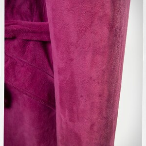 From Oshawa66Vintage.com online consignment store and luxury resale vintage clothing for men and ladies. Vintage 60s-70s mod style dark hot pink kid suede coat with a low profile mandarin collar.