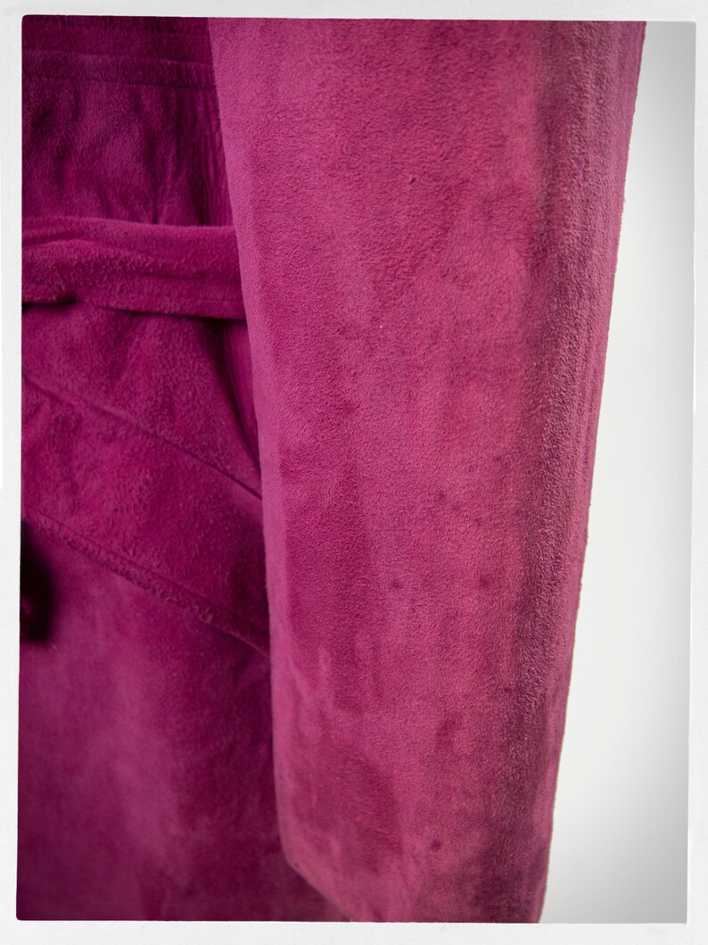 From Oshawa66Vintage.com online consignment store and luxury resale vintage clothing for men and ladies. Vintage 60s-70s mod style dark hot pink kid suede coat with a low profile mandarin collar.
