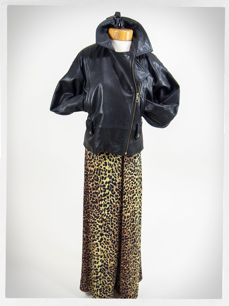 Vintage 80s-90s, new wave style iconic black leather Motorcycle Jacket, designed by ANDREW MARC. The leather is "butter" soft and medium weight. This jacket has a wonderful "new wave" vibe, the shoulders are oversized and padded.