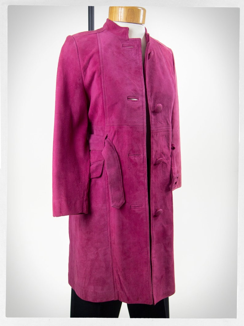 From Oshawa66Vintage.com online consignment store and luxury resale vintage clothing for men and ladies. Vintage 60s-70s mod style dark hot pink kid suede coat with a low profile mandarin collar.