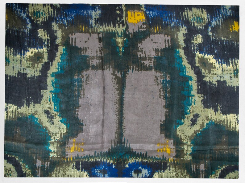 May include: Abstract patterned fabric in shades of blue, green, and gray. The fabric has a subtle sheen and a soft, flowing texture.