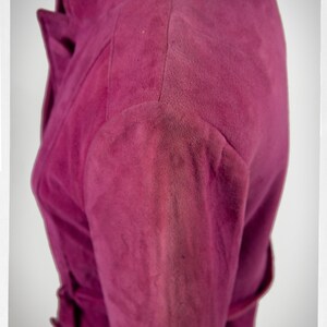 From Oshawa66Vintage.com online consignment store and luxury resale vintage clothing for men and ladies. Vintage 60s-70s mod style dark hot pink kid suede coat with a low profile mandarin collar.