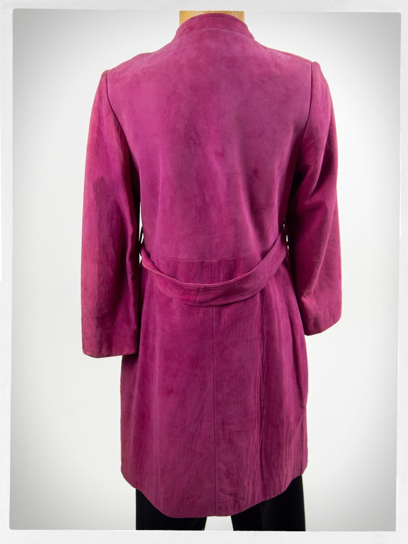 From Oshawa66Vintage.com online consignment store and luxury resale vintage clothing for men and ladies. Vintage 60s-70s mod style dark hot pink kid suede coat with a low profile mandarin collar.