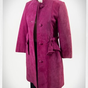 From Oshawa66Vintage.com online consignment store and luxury resale vintage clothing for men and ladies. Vintage 60s-70s mod style dark hot pink kid suede coat with a low profile mandarin collar.