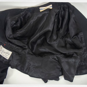 May include: Black blazer with a satin lining and a label that reads "Beverley Fine & Worsteds".
