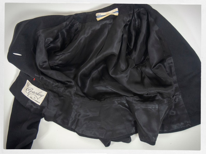 May include: Black blazer with a satin lining and a label that reads "Beverley Fine & Worsteds".