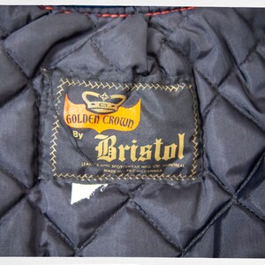 May include: A black quilted jacket with a brown label that reads "Golden Crown by Bristol Leather and Sportswear Mfg. Ltd. Montreal Made in Canada".