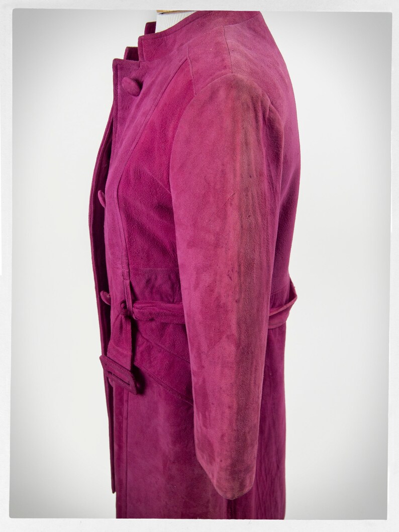 From Oshawa66Vintage.com online consignment store and luxury resale vintage clothing for men and ladies. Vintage 60s-70s mod style dark hot pink kid suede coat with a low profile mandarin collar.