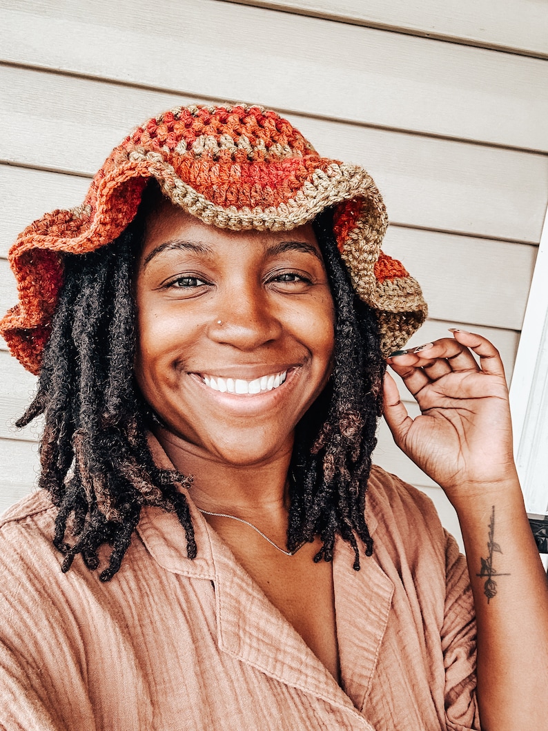 A handmade crochet ruffle bucket hat with soft yarn and a wavy ruffle brim for a playful touch. Lightweight and breathable, perfect for spring and summer. Versatile accessory for beach days, festivals, or casual outfits. Stylish, and  cozy.