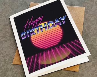 May include: A retro-style birthday card with the text "Happy Birthday" in a colorful, 80s-inspired font. The card features a pink and yellow sun with a striped pattern, set against a black background with a grid of pink and purple lines.