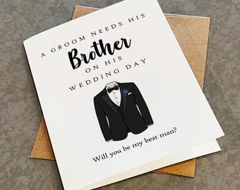 May include: A white greeting card with black text that reads A GROOM NEEDS HIS Brother ON HIS WEDDING DAY and Will you be my best man? The card features a centered illustration of a black tuxedo jacket with a white shirt, black bow tie, and blue flower.