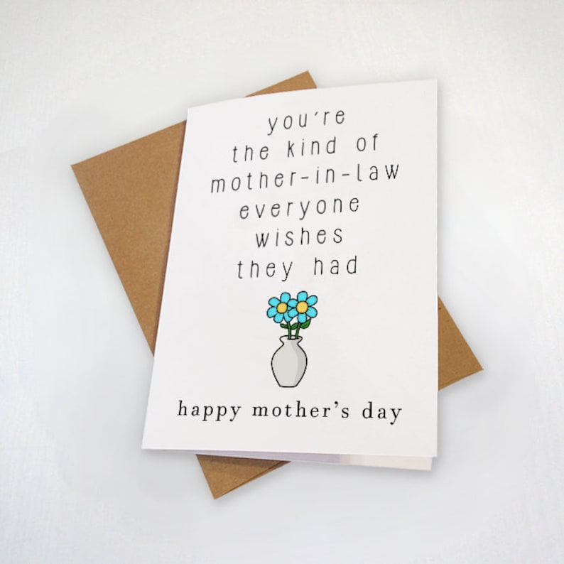 May include: A white card with a black and white illustration of a vase with blue flowers. The card reads "you're the kind of mother-in-law everyone wishes they had" and "happy mother's day".
