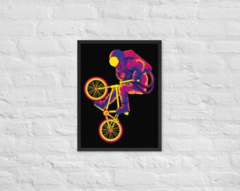 May include: A colorful illustration of an astronaut riding a BMX bike with a black background. The astronaut is wearing a red and blue spacesuit with a yellow helmet. The bike is yellow and blue with black tires.