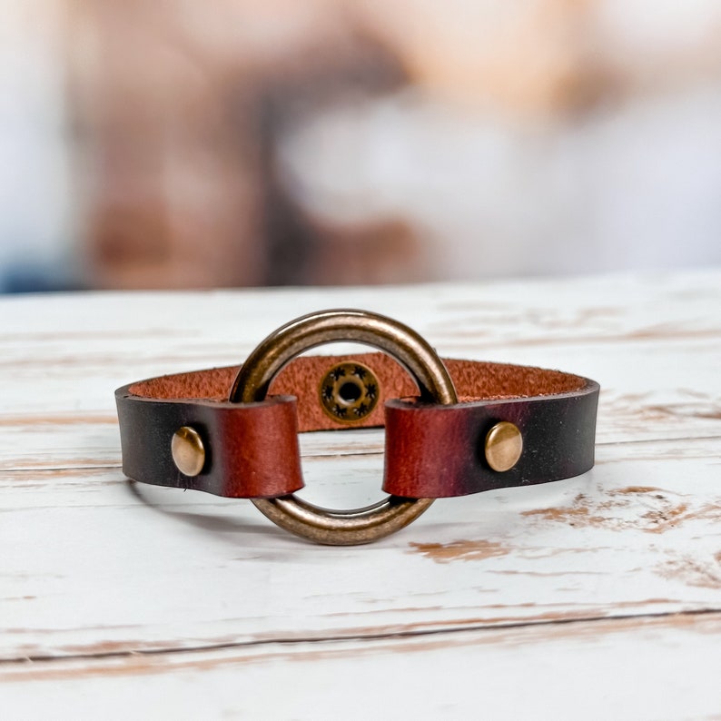 Leather cuff bracelet with 1" antique brass ring.
