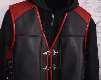 May include: Black leather vest with red trim and silver clasps. The vest has a lace-up detail on the sides.