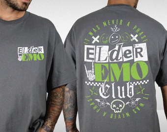 May include: A gray t-shirt with the text "Elder Emo Club" printed on the back. The text is in a distressed, punk rock style with green and white lettering. The front of the shirt has the text "Elder Emo" printed in white.