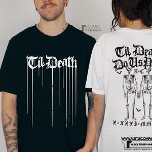 May include: Two black t-shirts with white text. The front of one shirt says "Til Death" with dripping lines. The back of the other shirt says "Til Death Do Us Part" with two skeletons holding hands and the text "A+C" and "X. XXXI. MMXV".