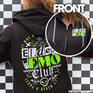 May include: Black zip-up hoodie with a green and white graphic print that says "It Was Never A Phase Elder Emo Club". The front of the hoodie has a smaller green and white graphic print that says "Elder Emo".