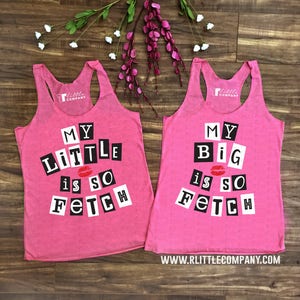 May include: Two pink tank tops with a black and white graphic print that says "My Little is so Fetch" and "My Big is so Fetch".