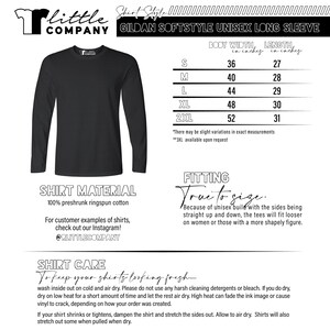 May include: A black long-sleeve shirt with the text "Little Company" and "Gildan Softstyle Unisex Long Sleeve" printed on it. The shirt is shown on a white background with a size chart and care instructions. The size chart shows the body width and length in inches for sizes S, M, L, XL, and 2XL.