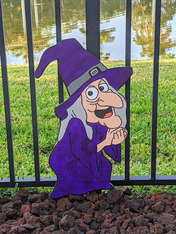 Deck out your front yard with this spooky Halloween Purple Witch Wood Yard Art from Camp Cousins Crafts on Etsy. This outdoor lawn decoration is perfect for adding a touch of Halloween magic to your home and is sure to impress trick-or-treaters and neighbors alike.