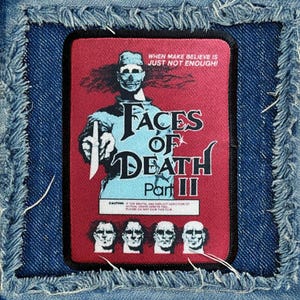 May include: A red and blue patch with the text "Faces of Death Part II" and a cautionary message about the graphic content of the film. The patch features a masked figure holding a knife.