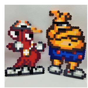 May include: Two pixel art characters made with colorful beads. The character on the left is red with a white hat and is wearing a white shirt with a red stripe. The character on the right is yellow with a blue hat and is wearing blue shorts with red accents.