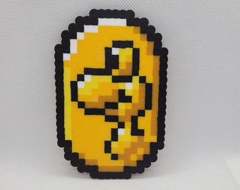 Yoshi Coin Perler, Super Mario World, pixel art perler 8 bits, SNES, power-up, aimant, bas de rembourrage, décoration murale