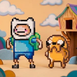 May include: A pixel art figure of a white-hatted character with a blue shirt and green backpack standing next to a yellow dog figure. Nearby is a small wooden treehouse structure, a golden sword, and a circular shield made of pixelated beads.