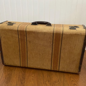 May include: A rustic wooden sign with the text "Welcome to our home" in a handwritten style. The sign features a distressed finish and a simple, inviting design, perfect for a front porch or entryway.